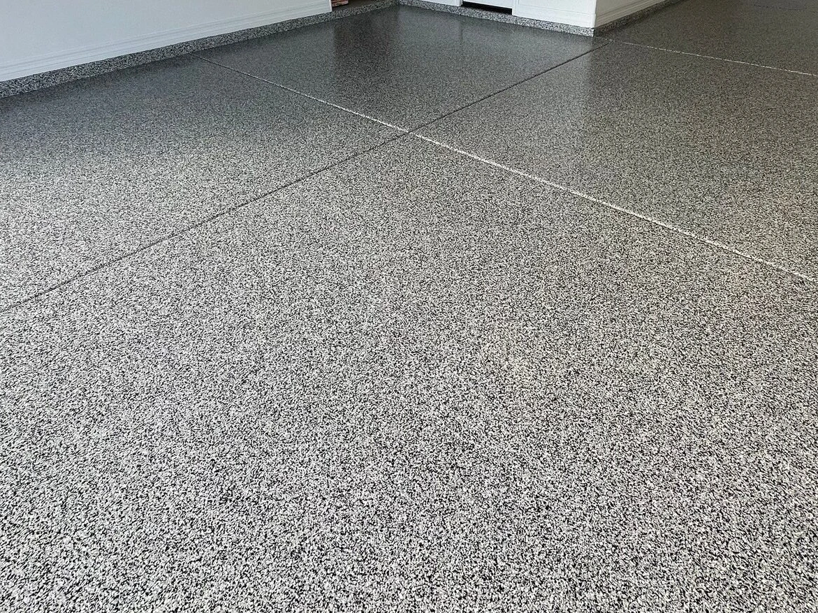 Concrete surface preparation tools and prepped concrete floor